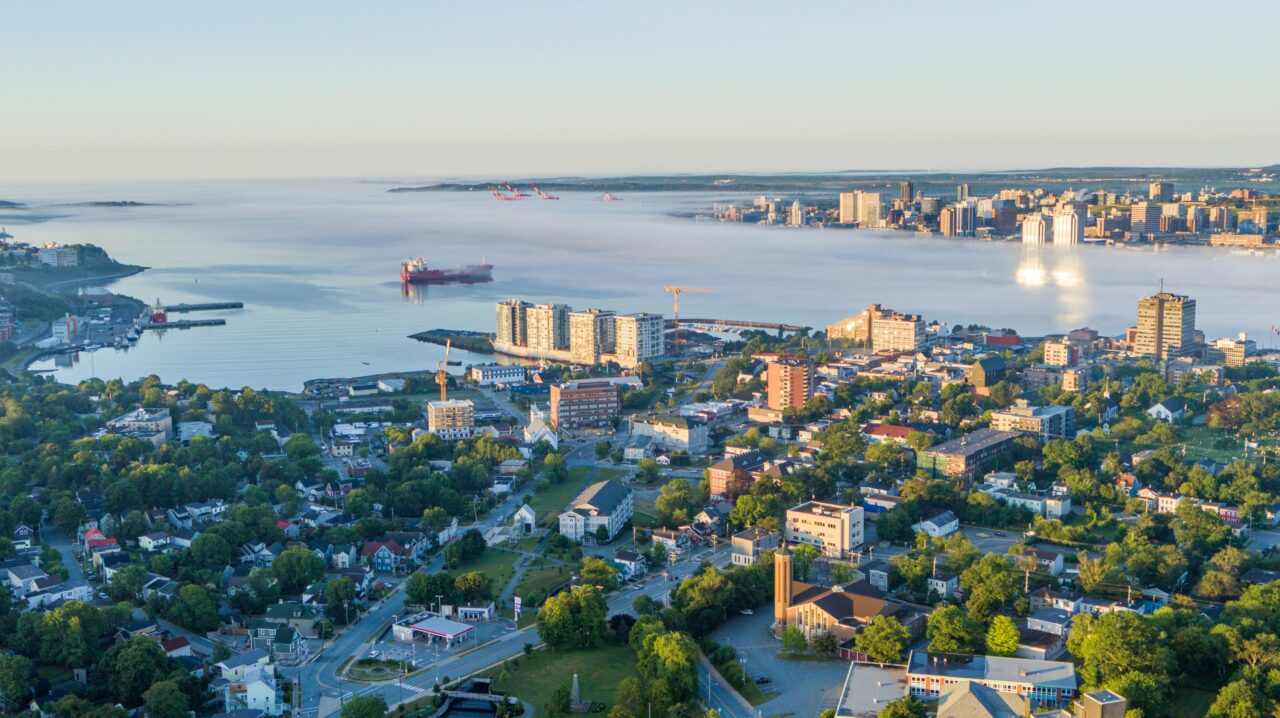 An aerial of Downtown Dartmouth on a sunny summer morning. The south end container terminal can be seen in the background.