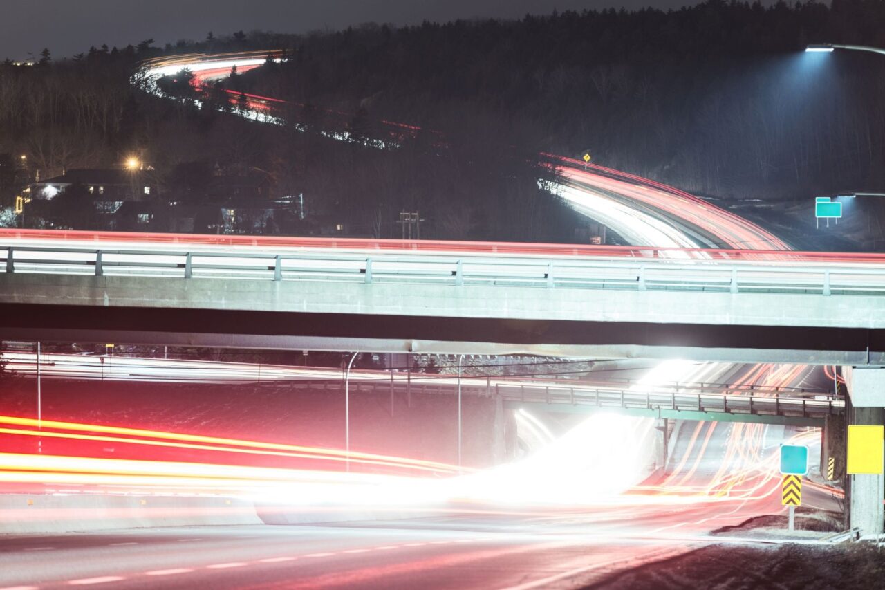 A long-exposure photo of Highway 102 by Exit 3 at night, facing inbound.